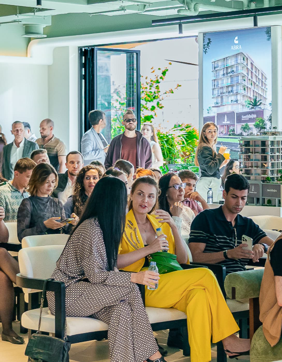 ABRA gathering in a bright event space with seated guests